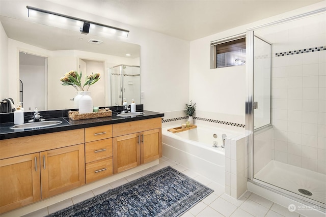 bathroom with tile patterned floors, vanity, and plus walk in shower