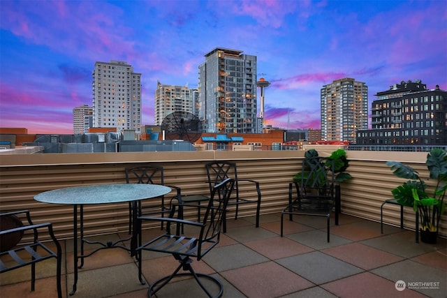 view of balcony at dusk