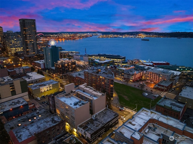 aerial view at dusk with a water view