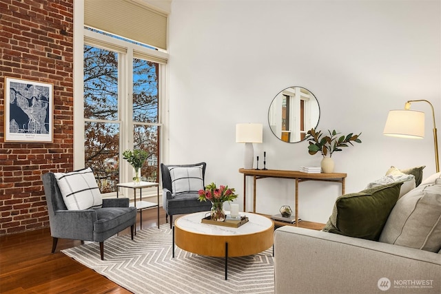 2324 1st Ave Unit 202, Seattle, WA 98121 - sitting room with wood finished floors and brick wall