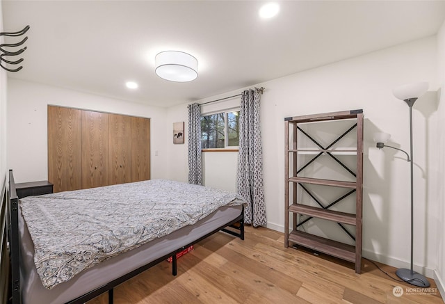 bedroom with light hardwood / wood-style floors