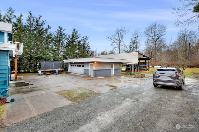 garage featuring an outdoor structure