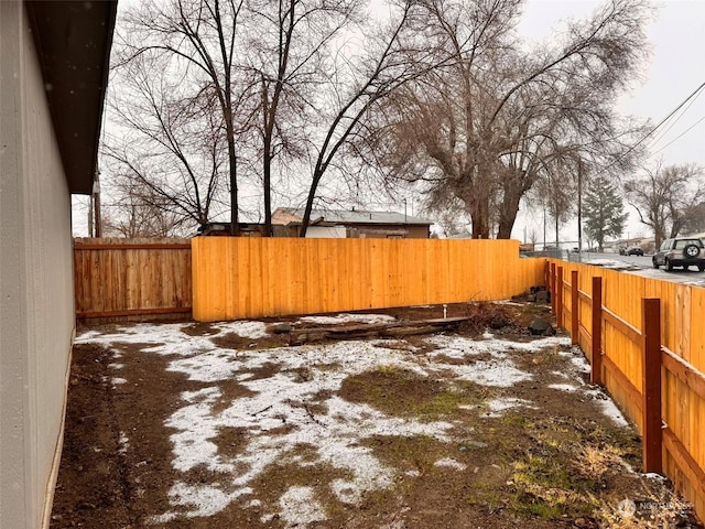 view of yard layered in snow