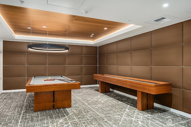 playroom with a tray ceiling, dark carpet, tile walls, and billiards