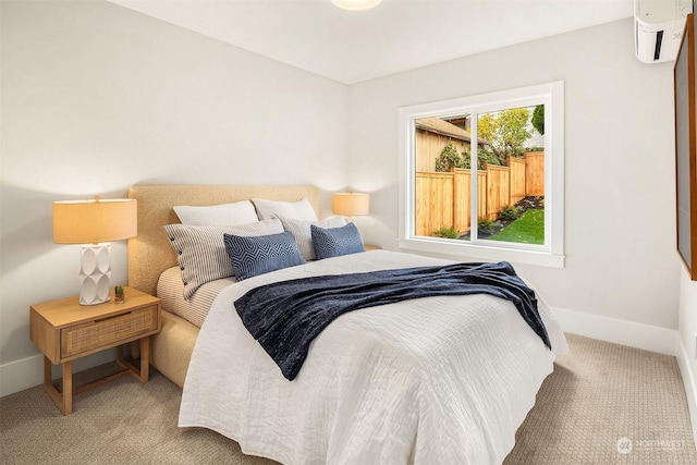 bedroom with a wall mounted air conditioner and carpet floors