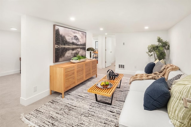 living room featuring light carpet