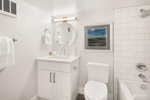 full bathroom with vanity, toilet, and tiled shower / bath combo