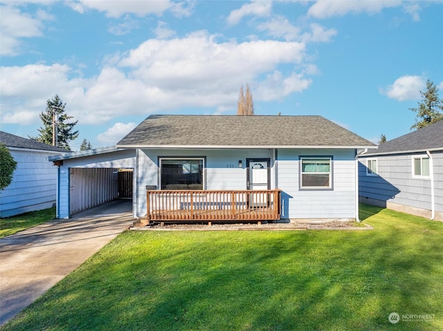 view of front of property featuring a carport and a front lawn