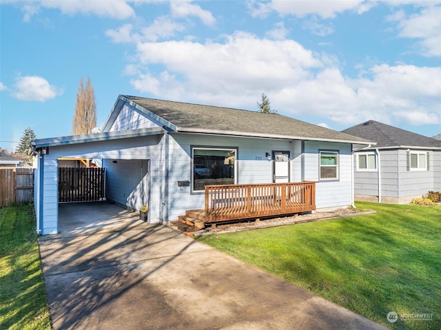 ranch-style house featuring a carport, a deck, and a front yard