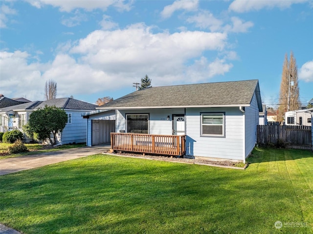 ranch-style house with a wooden deck and a front yard