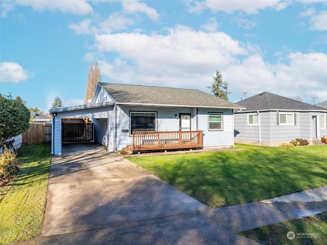 view of front of home with a carport and a front lawn