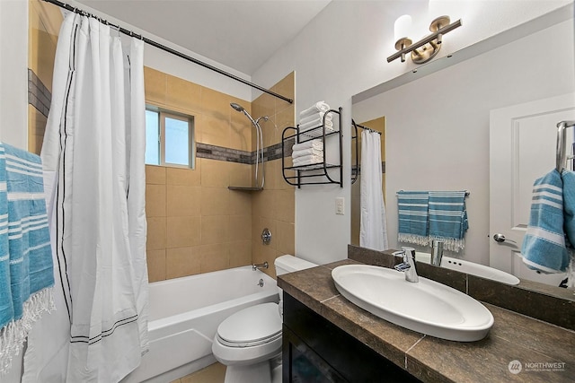 full bathroom with shower / tub combo with curtain, vanity, and toilet