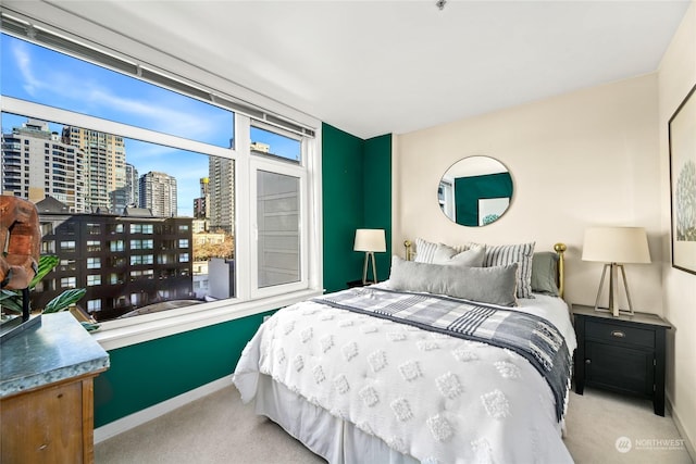 bedroom with light colored carpet