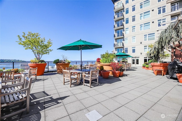 view of patio / terrace with a water view