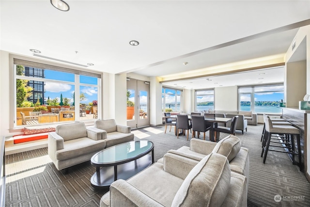 carpeted living room featuring french doors