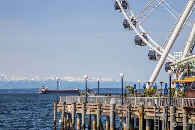 dock area featuring a water and mountain view