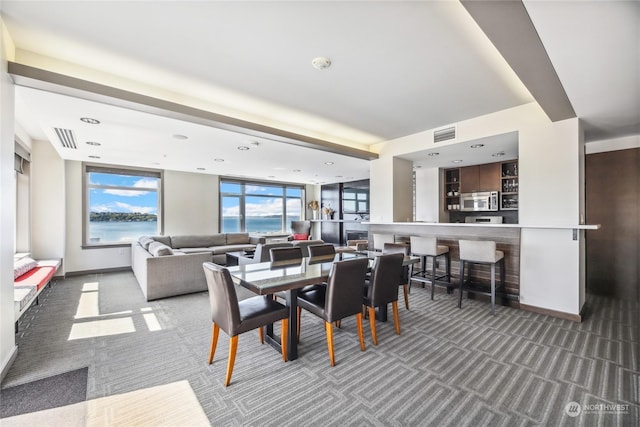 dining area with dark carpet