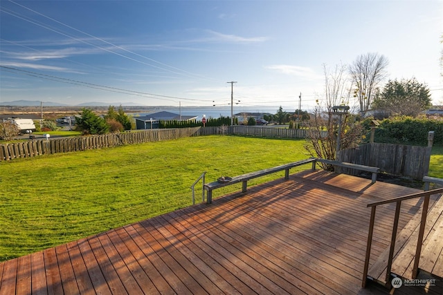 wooden terrace with a yard