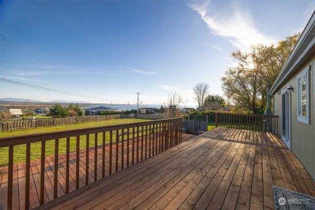 deck with a lawn and a mountain view