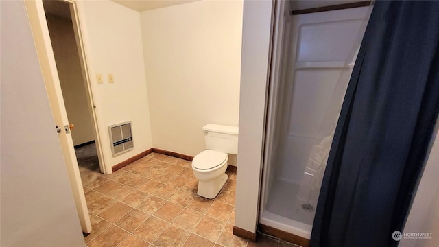 full bathroom with tile patterned floors, a walk in shower, baseboards, toilet, and heating unit