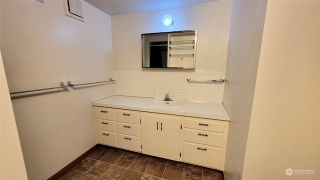 bathroom featuring vanity and baseboards