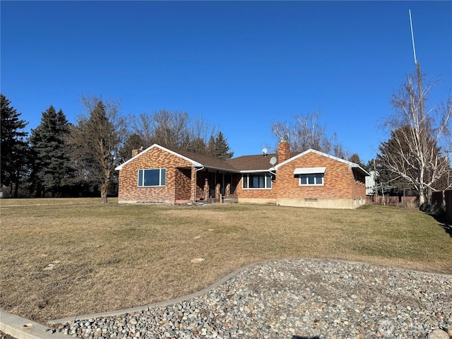 single story home featuring a front lawn, crawl space, brick siding, and a chimney