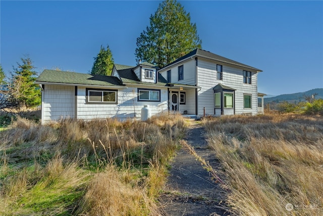 view of front of house with a mountain view