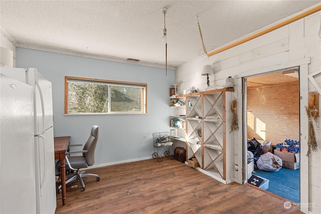 office featuring hardwood / wood-style floors and a textured ceiling