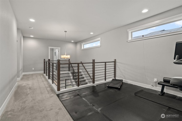 exercise room with carpet and a wealth of natural light