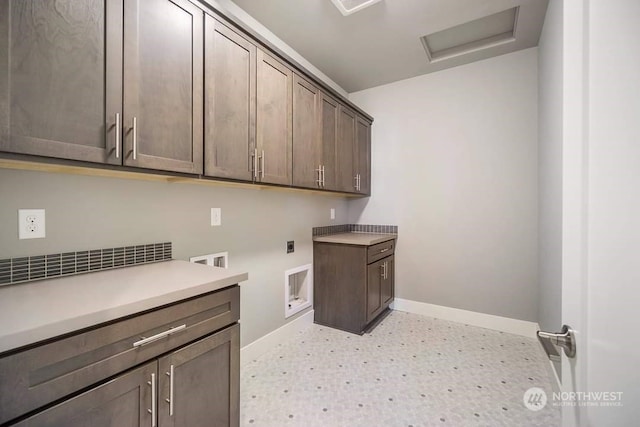 clothes washing area with washer hookup, cabinets, and hookup for an electric dryer