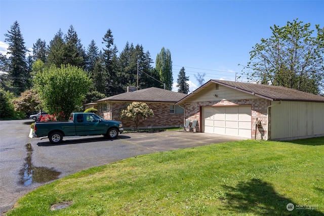 exterior space featuring a garage and a front yard