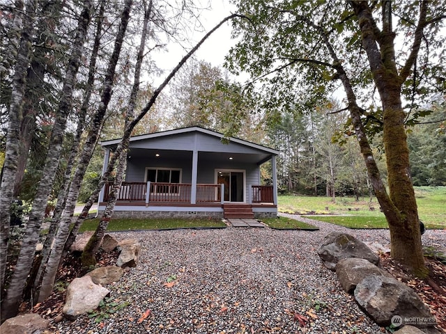 16818 57th St NW, Vaughn, WA 98394 - view of front facade featuring a porch