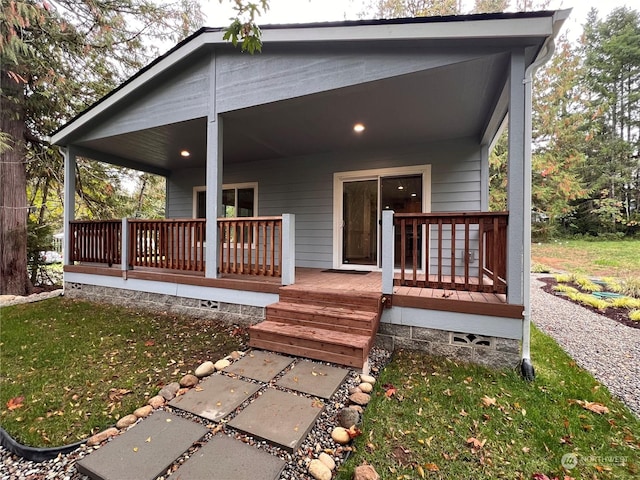 rear view of property with covered porch