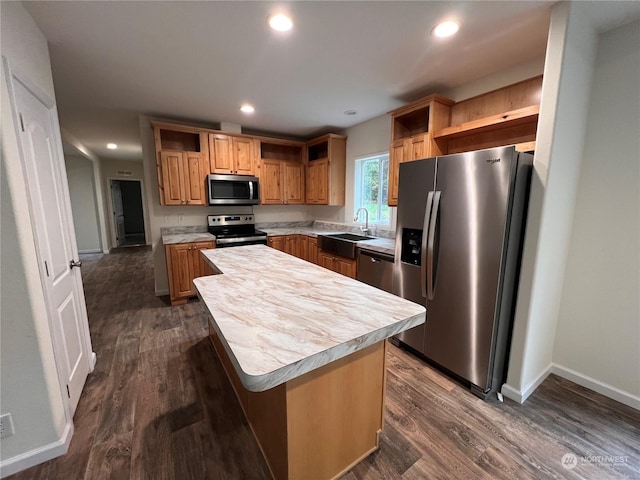 kitchen with stainless steel appliances, a kitchen island, dark hardwood / wood-style floors, and sink