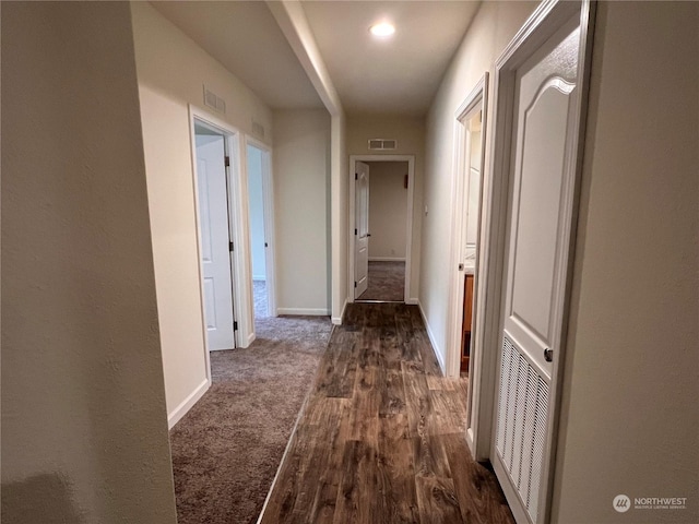 hallway with dark wood-type flooring