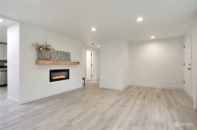 unfurnished living room with light hardwood / wood-style floors