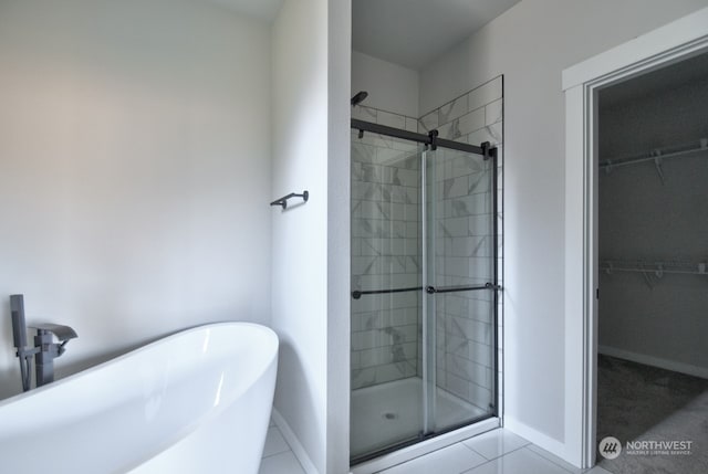 bathroom with shower with separate bathtub