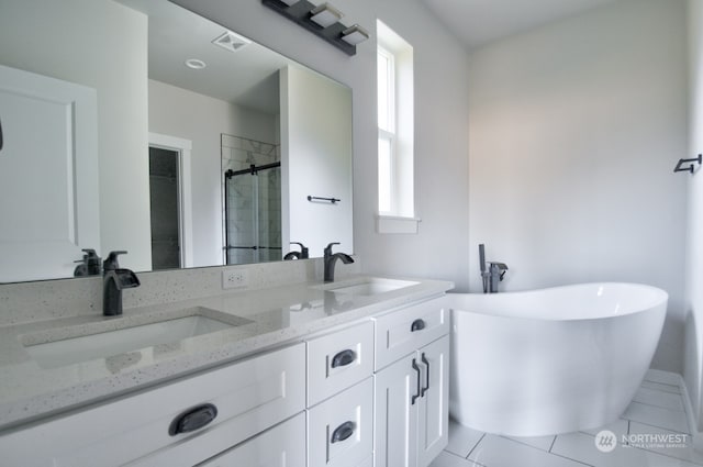 bathroom featuring tile patterned flooring, vanity, and independent shower and bath