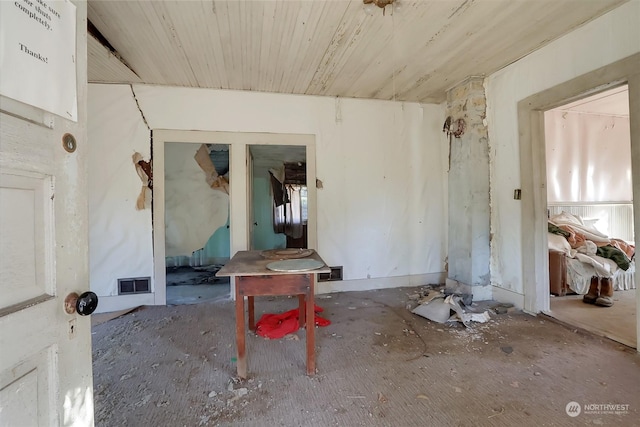 interior space with wood ceiling and visible vents