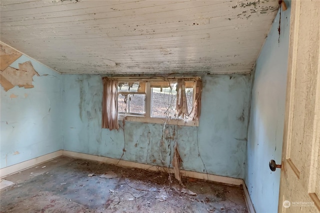 unfurnished room featuring wood ceiling and baseboards