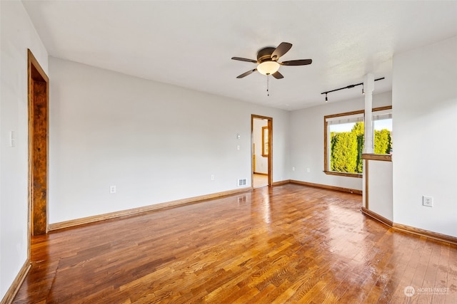 unfurnished room featuring hardwood / wood-style flooring and ceiling fan