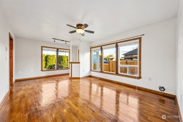 spare room featuring ceiling fan and hardwood / wood-style flooring