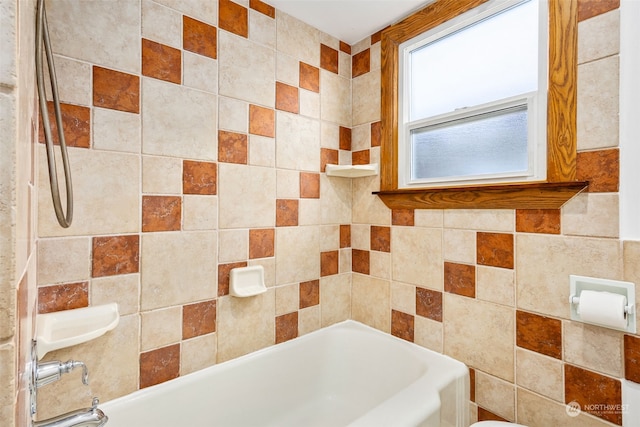 bathroom with shower / tub combination and tile walls