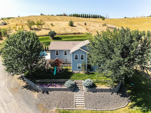 birds eye view of property with a rural view