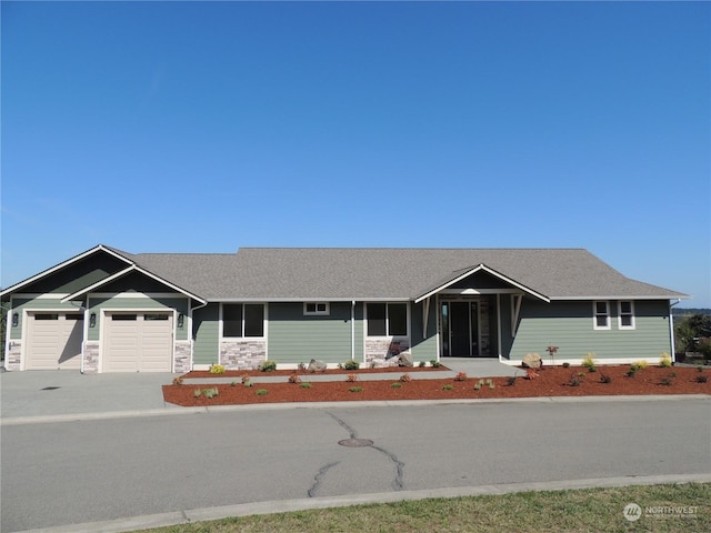 single story home with a garage