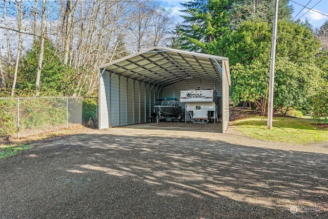 view of parking / parking lot with a carport