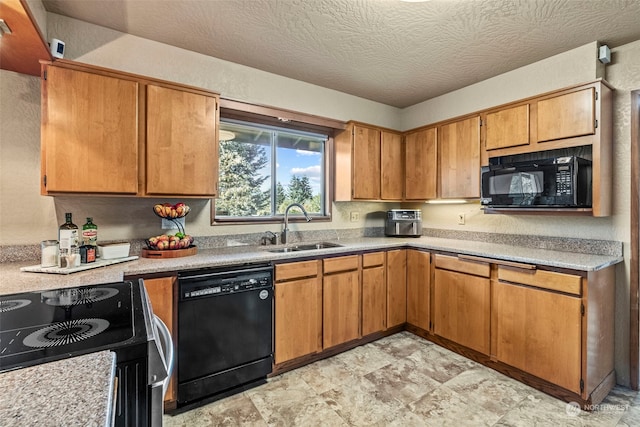 kitchen featuring a textured ceiling, sink, and black appliances