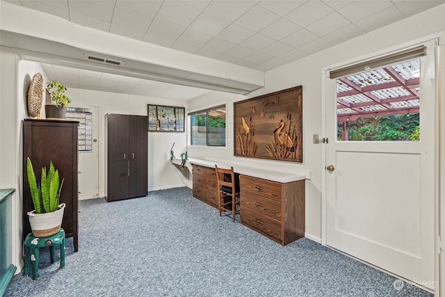 office featuring beam ceiling and carpet floors