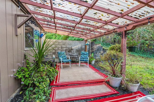 view of patio featuring a pergola