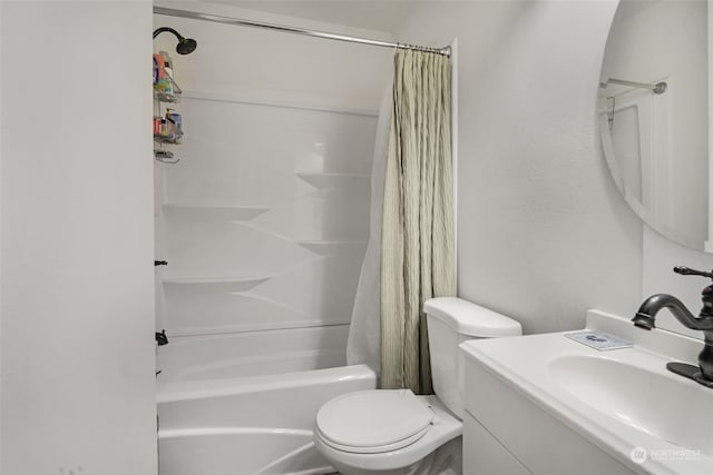 full bathroom featuring vanity, shower / bath combination with curtain, and toilet